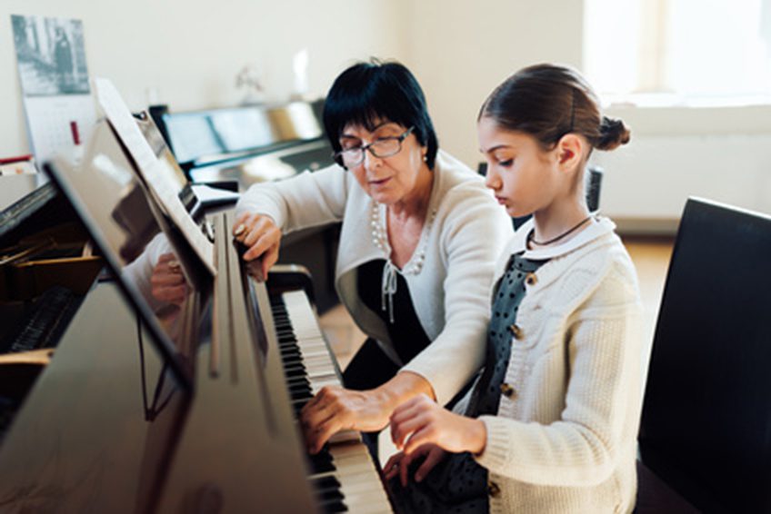 Pushy parents; getting music teacher to show child how to play piano