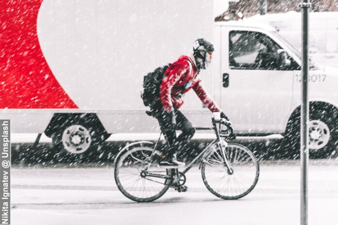Cyclist in Bad Weather on Vancouver Road Canada