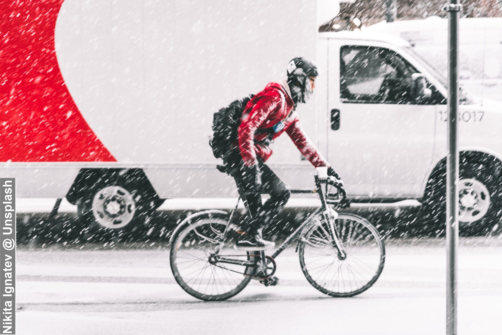 Cyclist in Bad Weather on Vancouver Road Canada