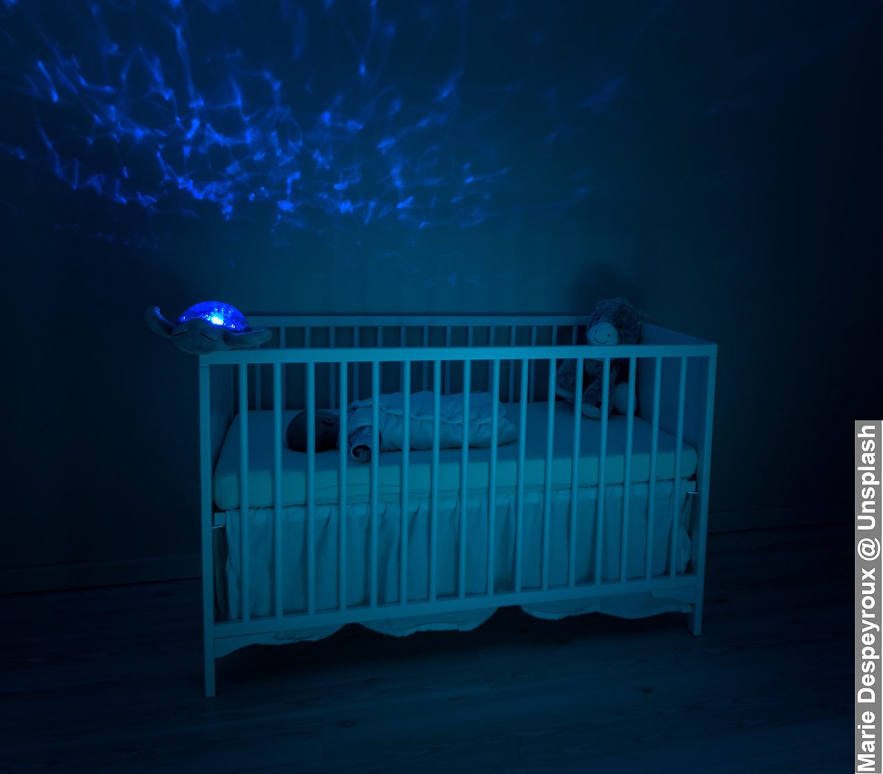 Kids get used to sleeping by themselves baby in room and in bed with ceiling night light projector on