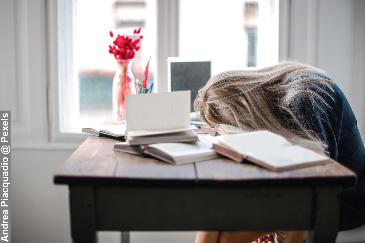 Adolescence woman leaning and sleep on a table