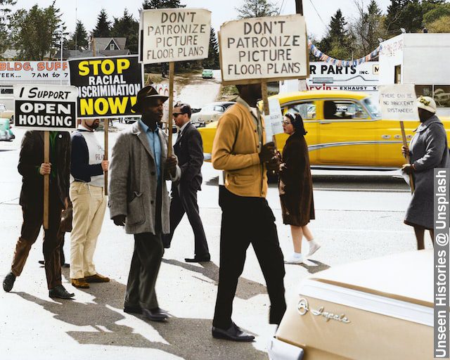 Demonstrators with placards, black history, better future for my children