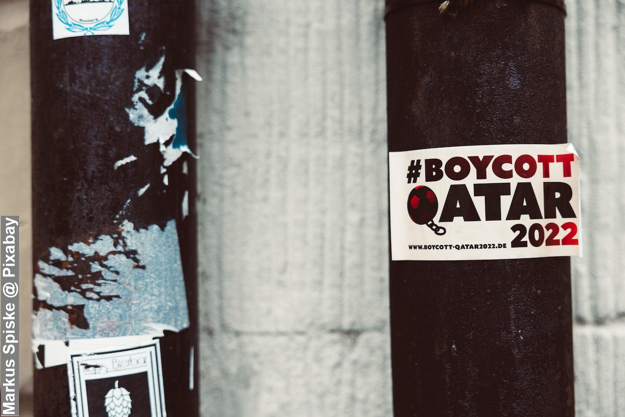 Boycott Qatar sticker stuck on post, Qatar merits The FIFA World Cup 2022