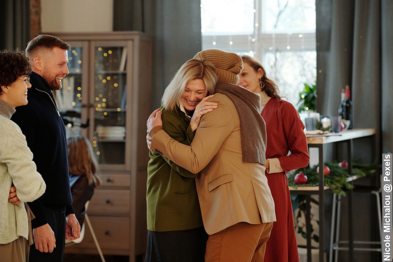 Family getting together during Christmas, family greeting each other in room