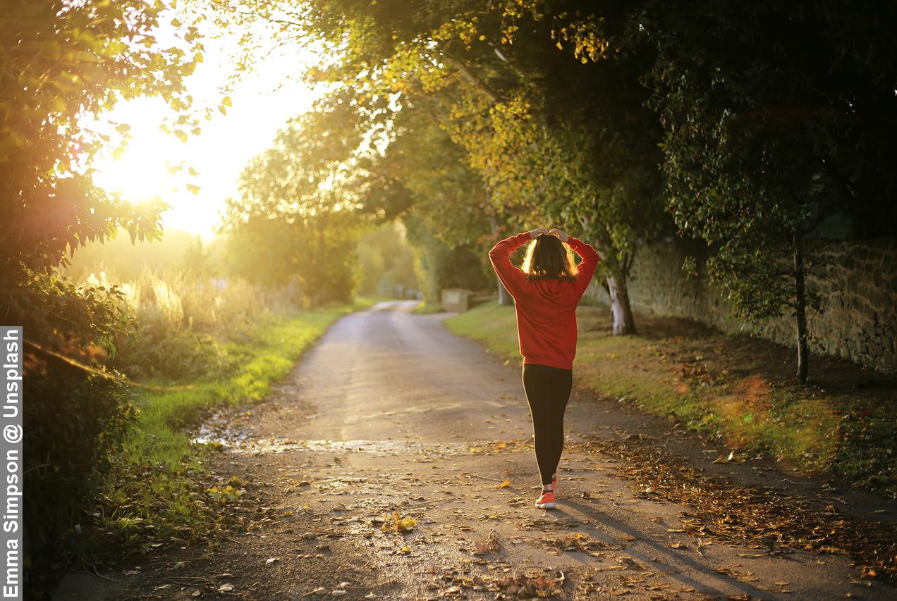 Lady morning walk in leafy countryside