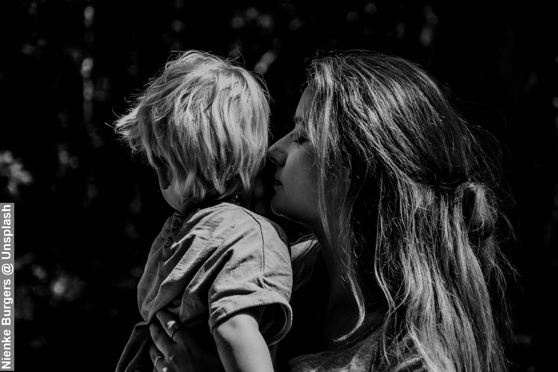 Black and white of mother holding daughter showing care and sensitivity