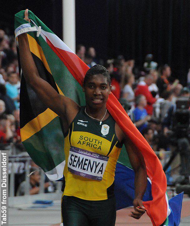 Caster Semenya at the 2012 Summer Olympics holding South Africa flag